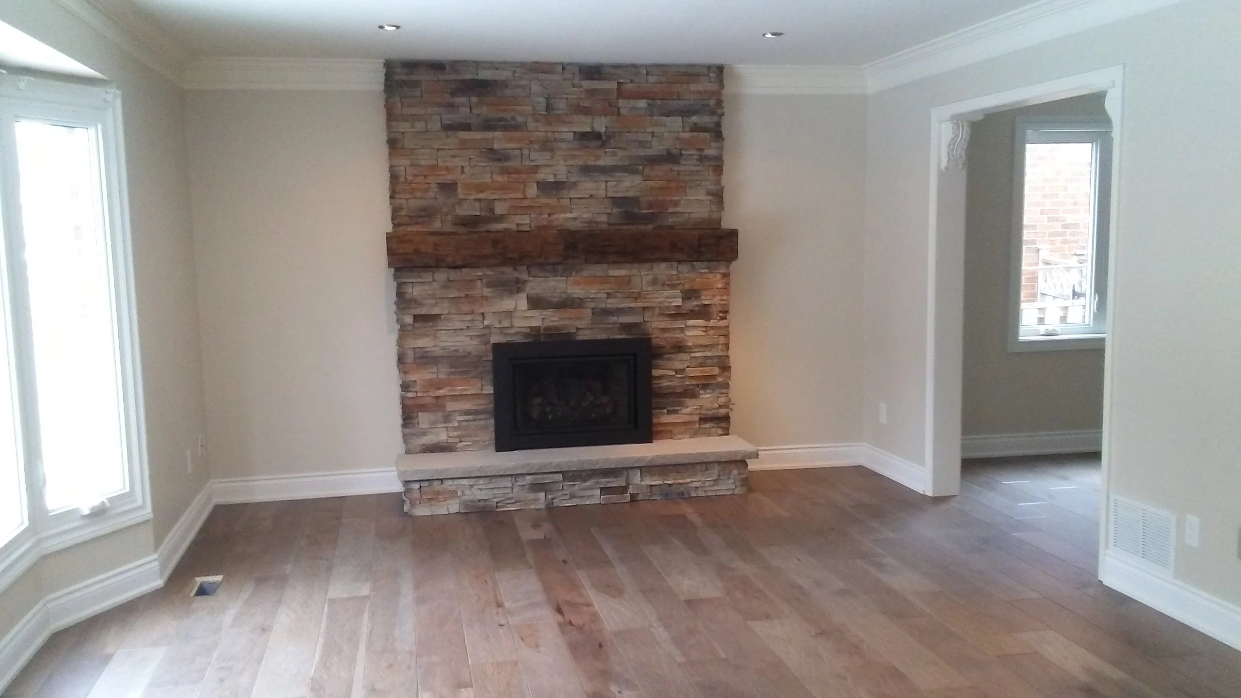 hickory hardwood floor barn beam fireplace mantel